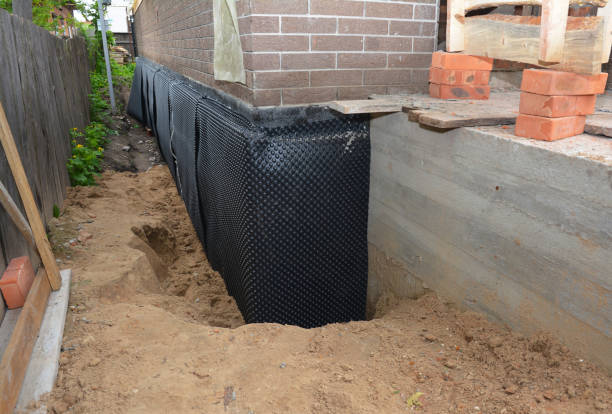 Happy homeowners after waterproofing job in Mellott
